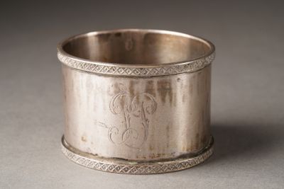 a silver cup that is sitting on a table