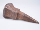 an old wooden hammer on a white surface with a white background