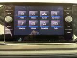 a close up of a car ' s dashboard with a touch screen