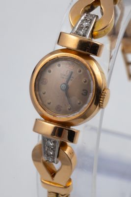 an image of a lady ' s wrist watch with diamonds on it