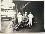 black and white photograph of a group of naked men and women posing for a picture