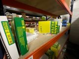 many boxes on a shelf in a store