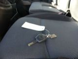 a car key sitting on the back seat of a car