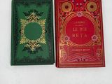 two books that are sitting side by side on a table