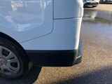 a white van that is parked in a parking lot