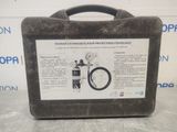 an image of a suitcase with a pressure gauge attached to it