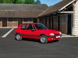 a small red car parked in front of a building