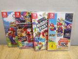 the nintendo wii games are lined up on a table