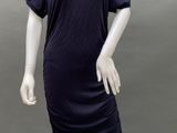 an image of a mannequin wearing a blue dress with a black collar