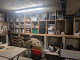 a room filled with lots of boxes and shelves