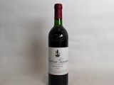 a bottle of wine that is sitting on a table