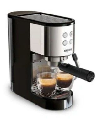 gros plan d'une machine à café avec deux tasses de café