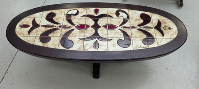 a coffee table with a mosaic design on it