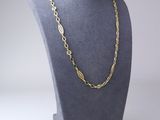 a gold chain necklace on a mannequin mannequin mannequin mannequin mannequin mannequin mannequin mannequin manne