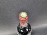a bottle of wine that is sitting on a table