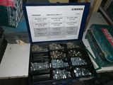 a box of nuts and bolts sitting on a table