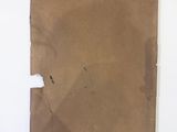 an image of a piece of brown paper on a white surface