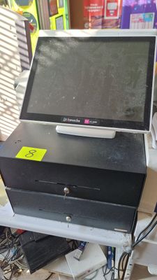 a computer sitting on top of a desk in a room