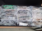 a box of assorted electronics sitting on a desk