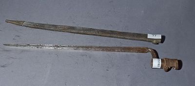 two old tools that are laying on a table