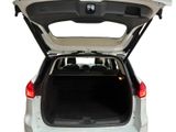 the back of a white car with its trunk open on a white background