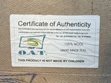 a sign on the back of a chair that says certificate of authenticity