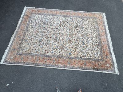 a rug on the ground next to a pair of shoes