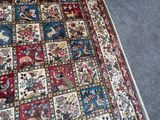 a rug on the floor with a cat laying on it