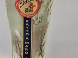 a glass vase with a label on it that says stella