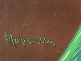 a picture of a green banana on a brown surface