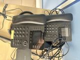 two telephones that are sitting next to each other on a table