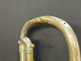 a brass faucet that is sitting on a table