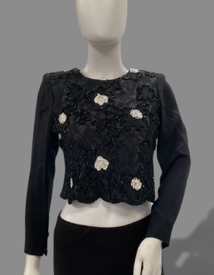 an image of a mannequin wearing a black top and skirt