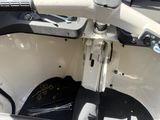 a close up view of the steering wheel and dashboard of a boat
