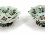 pair of chinese famille bowls with birds and flowers on green ground