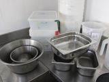 many pots and pans that are on the kitchen counter