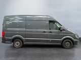 a grey van that is parked in a parking lot