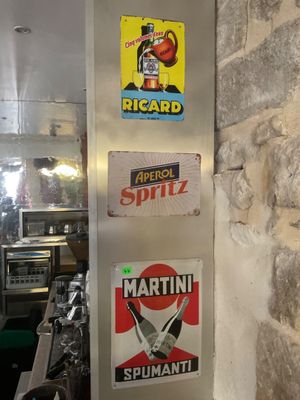 many stickers on the wall of a restaurant