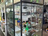 a glass display case with a lot of items inside of it