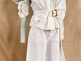 an image of a mannequin dressed in a white coat and pants