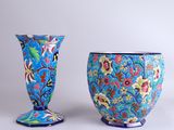 two vases sitting next to each other on a table