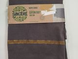 collants en coton bio marron, avec une bande dorée sur fond blanc