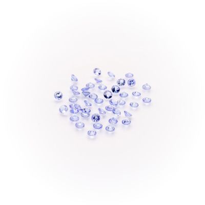 a pile of clear glass beads on a white surface