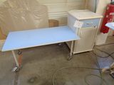 an image of a desk with a printer on it in a garage
