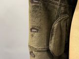 a close up of a pair of pants hanging on a hanger