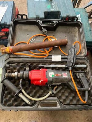 a tool in a case that is sitting on the ground