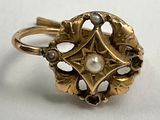 an image of a gold ring with a pearl in the center