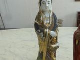 two figurines that are sitting on a table