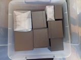 a plastic container filled with brown and white blocks