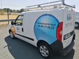 a van that is parked on the side of the road